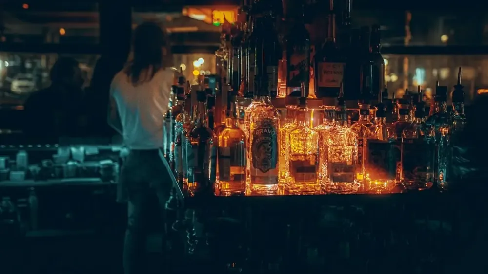 A glowing back-bar of bottles